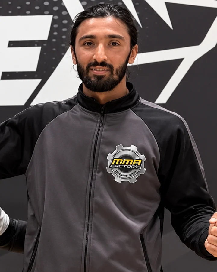 Coach Amar Johal in MMA Factory tracksuit