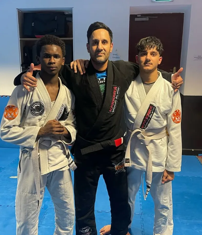 Coach Jag with two junior students after class